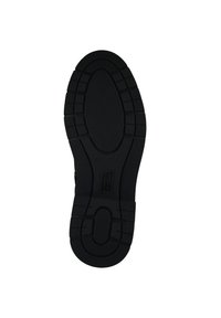 Semelle de chaussure en caoutchouc noir avec des rainures profondes, un motif central en grille et le numéro de taille 37 visible au centre.