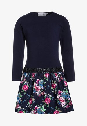 Vestido de manga larga azul marino con falda floral y cinturilla negra con lentejuelas.