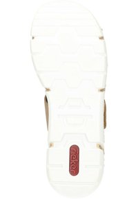 Semelle en caoutchouc blanc avec un motif de chaussure à semelle hexagonale, arborant un logo rouge. Matériau supérieur brun visible sur les côtés. Surface texturée pour une meilleure adhérence.