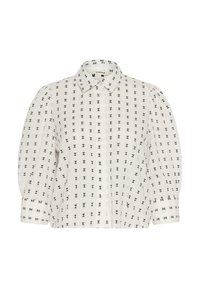 Blouse blanche avec un design à boutons et des motifs de papillons noirs. Des manches bouffantes et un col classique complètent le look.