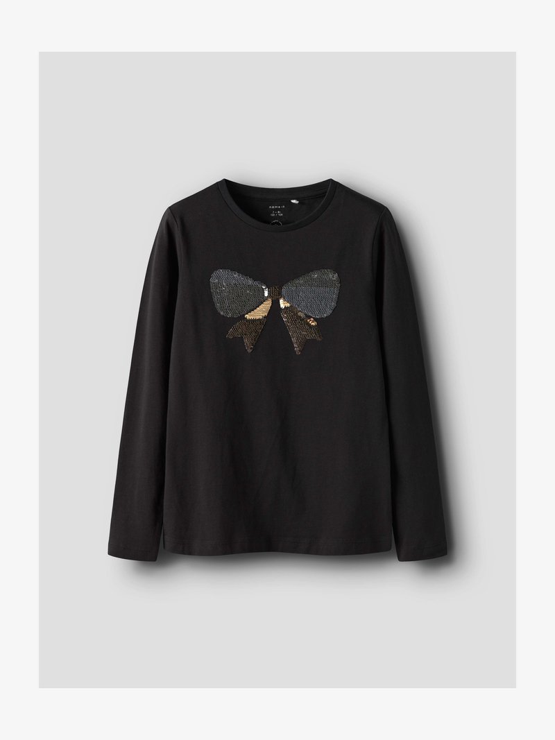 Μαύρο μακρυμάνικο πουκάμισο με μεγάλο λαμπερό φιόγκο από διπλής όψης παγιέτες σε μαύρο και χρυσό στο στήθος.