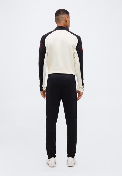 PUMA INDIVIDUALLIGA TRAINING PANTS - Tracksuit bottoms - black-ultra red-sugared almond — photo 3