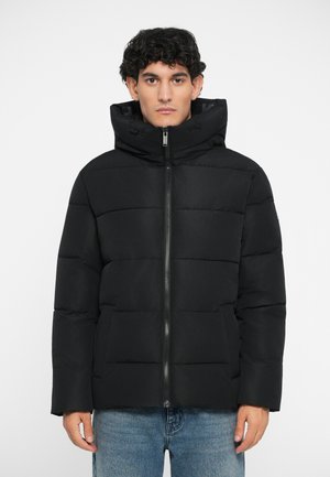 Black puffer jacket with a zip front, horizontal quilted design, and a hood. Features two front pockets and textured fabric.