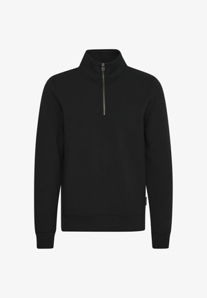 Must mustern lõpu tõmblukuga must särk kõrge kraega. Pikad varrukad ja soonikud mansettides. Pehme, sile riie, ilma mustrite või logodeta.