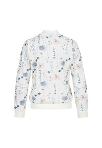 Sweatshirt floral en blanc avec des motifs de fleurs bleu clair et rose. Comprend des poignets et une taille côtelés ; col rond.