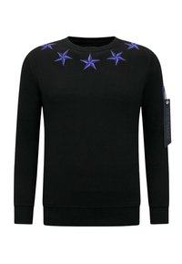 Zwarte sweatshirt met geborduurde paarse sterren langs de halslijn, geribbelde boorden en zoom, met een ritsaccent op de linkermouw.