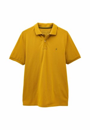 Lühikeste varrukatega sinepikollane polo-särk, millel on krae, kaks nööpaukku ja väike tikitud logo vasakul rinnal.