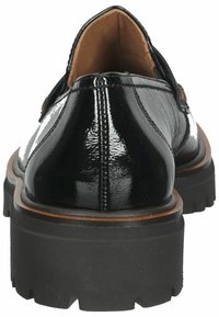 Black leather shoes with a shiny finish, round toe, and thick rubber sole. Features a brown trim and stitched detailing along the back.