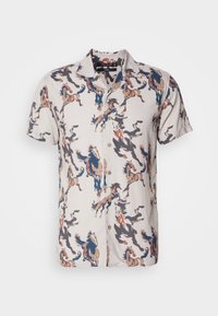 Chemise beige à manches courtes à boutons avec motif abstrait multicolore de chevaux en bleu, marron et noir.