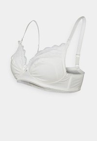 Sutiã branco com acabamento de rendas, copas com aro, alças ajustáveis e tecido suave. Apresenta um detalhe de laço no centro.