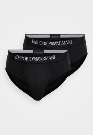 Slip en coton noir avec une ceinture souple portant le logo "Emporio Armani" en blanc, deux pièces affichées côte à côte.