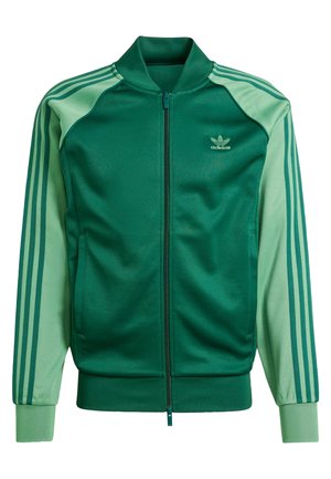 Green athletic jacket with a zip front, featuring contrasting green sleeves, three stripes on each arm, and a small logo on the chest.