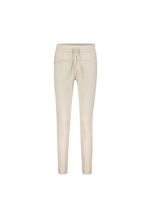 Beige joggerbukser med elastisk talje og snøring. Har to sidelommer og et slankt, tapered ben-design. Glat tekstur.