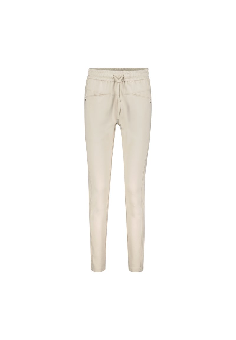 Beige joggerbukser med elastisk talje og snøring. Har to sidelommer og et slankt, tapered ben-design. Glat tekstur.