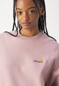 Carhartt WIP AMERICAN SCRIPT - Mikina - glassy pink