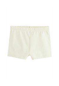 Shorts en tissu extensible beige clair uni avec ceinture élastique, conçus pour un ajustement près du corps.