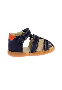 Navy and beige leather sandal with open toe design, adjustable straps, orange heel accent, and flexible rubber sole.