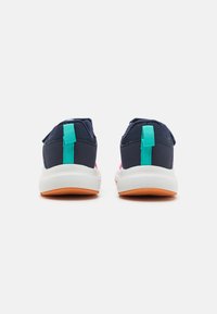 Navy blue athletic shoes with pink accents, featuring a textured textile upper, white midsole, and turquoise heel tabs. Orange outsole.