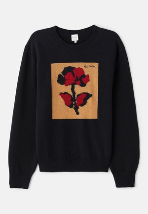 Knitted black sweater featuring a floral motif in red and black on a tan square. Includes ribbed cuffs and neckline. Brand label visible.