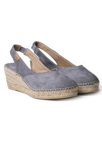 Gray suede slingback espadrilles with a wedge jute sole, featuring a cutout design and tan leather accent on the side.