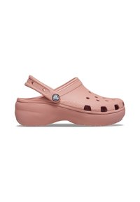 Sabot rose clair à enfiler avec des trous de ventilation, dessus texturé, bride de talon réglable et semelle épaisse.