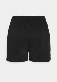 Shorts noirs à taille élastique, coupe ample et design simple, vus de dos sur fond blanc.