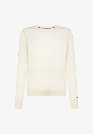 Maglione color crema con maniche lunghe, colletto rotondo, polsini e orlo a coste, caratterizzato da una leggera trama e un piccolo simbolo sulla manica sinistra.