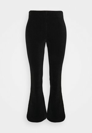 Schwarze Cordstoff-weit geschnittene Hosen mit gerippter Textur, elastischem Taillenbund und einem eng anliegenden oberen Bereich, der sich nach unten hin allmählich ausstellt.