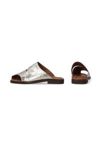 Metallic silver slide sandals with an open toe and cutout side design, featuring a smooth texture and a brown sole.
