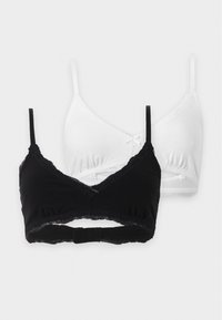 Deux soutiens-gorge sans armatures en noir et blanc, chacun avec de fines bretelles, une finition en dentelle, un petit nœud devant et des bonnets souples, présentés sur fond blanc.