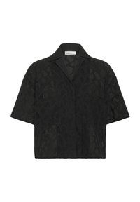 Chemise noire à manches courtes avec un design en dentelle géométrique texturée, col à encoches et coupe ample qui favorise la respirabilité.