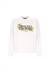 Felpa bianca con maniche lunghe, caratterizzata dal testo "VERSACE JEANS COUTURE" e dettagli floreali gialli e neri. Polsi e orlo a coste.
