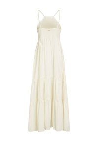 Longue robe d'été couleur crème avec bretelles fines, corsage froncé, petit détail bouton et jupe fluide à volants.