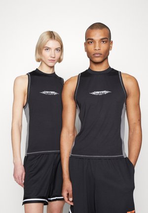 Black sleeveless athletic tops with gray side panels, featuring a logo on the front. Worn with black shorts, showing a sporty, fitted design.