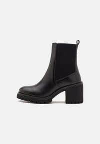 Black ankle boots made of smooth leather with elastic side panels, rounded toe, chunky heel, and ribbed rubber sole for grip.