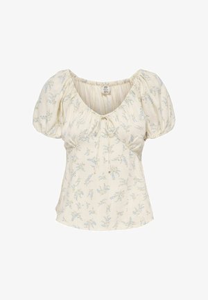 Blouse crème à manches courtes avec manches bouffantes, imprimé floral bleu délicat, encolure froncée et détail noué à l'avant.