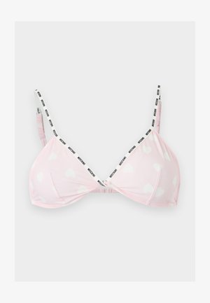 Bralette roz deschis cu modele albe de inimioare și bretele subțiri alb-negru cu logo, afișat aplatizat pe un fundal gri.
