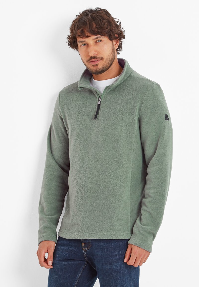 Light green fleece pullover with a quarter zip and high collar. Soft texture, long sleeves, and a logo on the left shoulder.