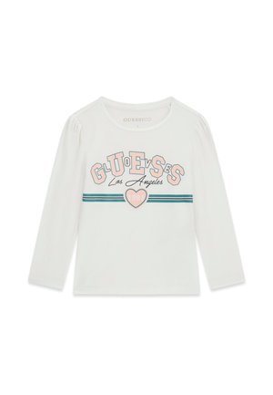 Camiseta blanca de manga larga con texto "GUESS Los Angeles" en rosa y azul, dos franjas horizontales azules y un corazón rosa con "98" en el centro.