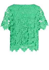 Grünes Spitzentop mit kurzen Ärmeln, das über aufwendige Aussparungen und einen gewellten Saum verfügt, aus leichtem Material gefertigt.