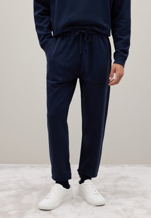 WITH ELASTIC WAISTBAND - Tracksuit bottoms - blue