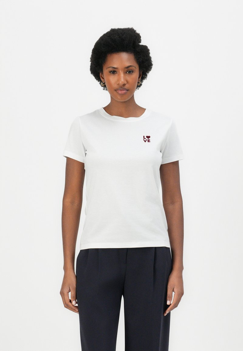 White cotton t-shirt with short sleeves and a round neckline. Features a small maroon "LOVE" graphic on the left chest.
