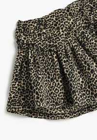 Leopardprint rok van zachte stof met eenGathered taille. Kenmerkt zwart en tan kleuren, plooien en een trekkoorddetail.