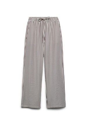 Pantalon blanc ample avec fines rayures verticales noires, taille élastique et cordon de serrage à l'avant.