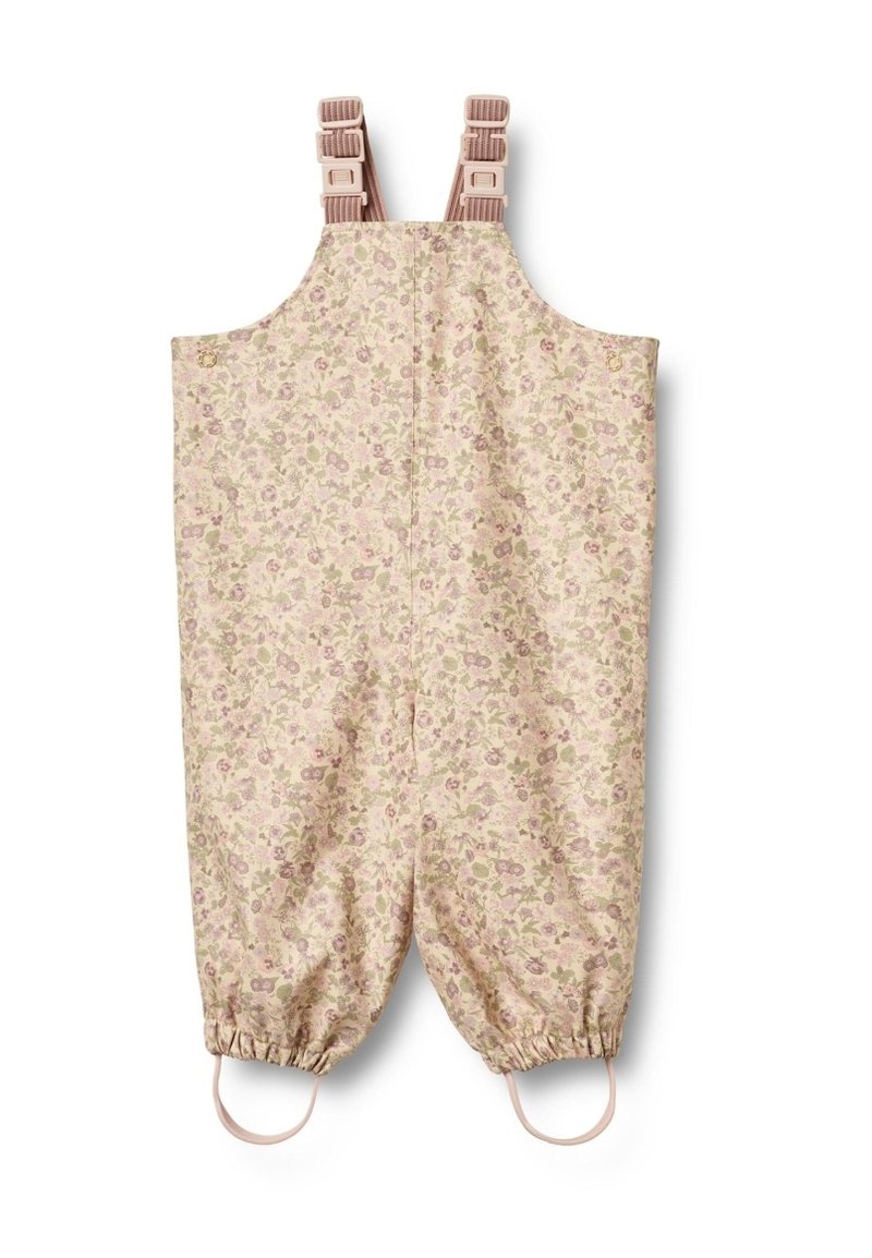 Blommönstrad overall i mjuk beige med justerbara axelremmar, elastiska ärmslut och ljusrosa detaljer. Overallens passform är avslappnad och tyget är lätt.