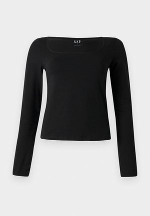 Haut noir à manches longues avec un décolleté carré, en tissu lisse, présentant un design ajusté et un ourlet droit. Étiquette visible à l'intérieur du décolleté.