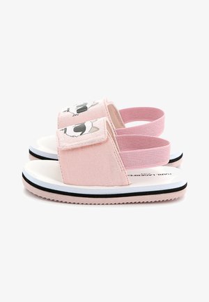 Roze stoffen sandalen met een witte zool, voorzien van een ontwerp van een cartoon dierenface, klittenbandsluiting en elastische bandjes voor een stevige pasvorm.