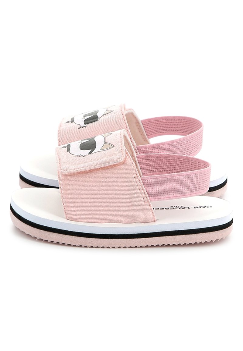 Sandales en tissu rose avec une semelle blanche, dotées d'un design de visage de cartoon d'animal, fermeture velcro et sangles élastiques pour un maintien sécurisé.