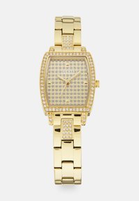 Gold-tone wristwatch with a square, textured face, adorned with multiple rhinestones and a metallic link bracelet. Brand logo visible.