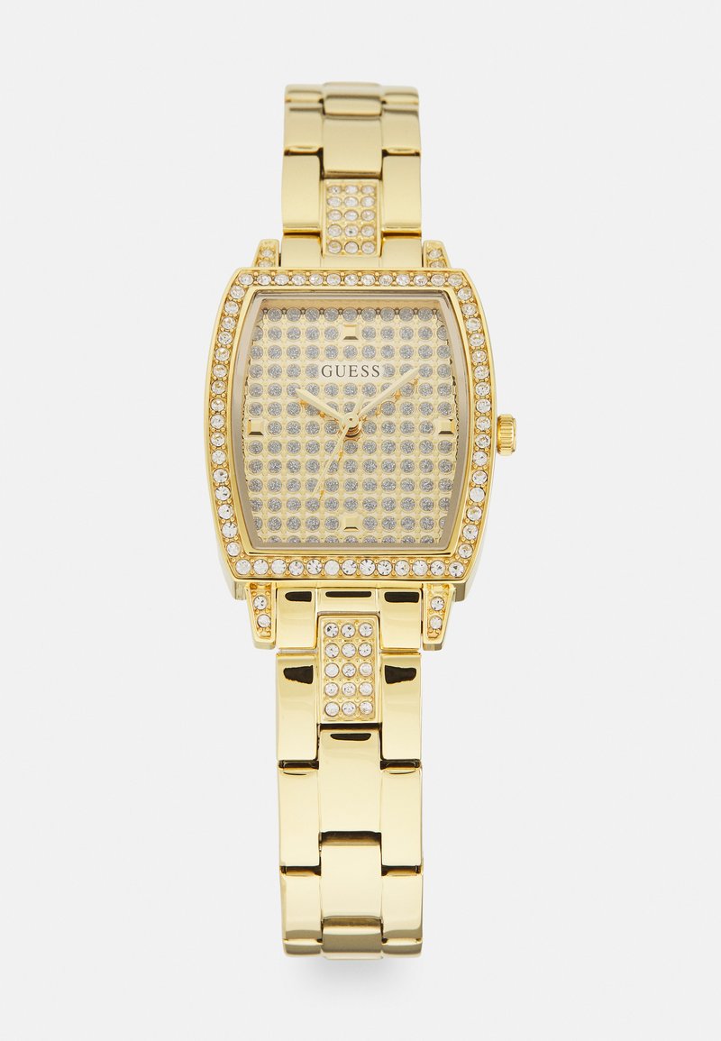 Gold-tone wristwatch with a square, textured face, adorned with multiple rhinestones and a metallic link bracelet. Brand logo visible.